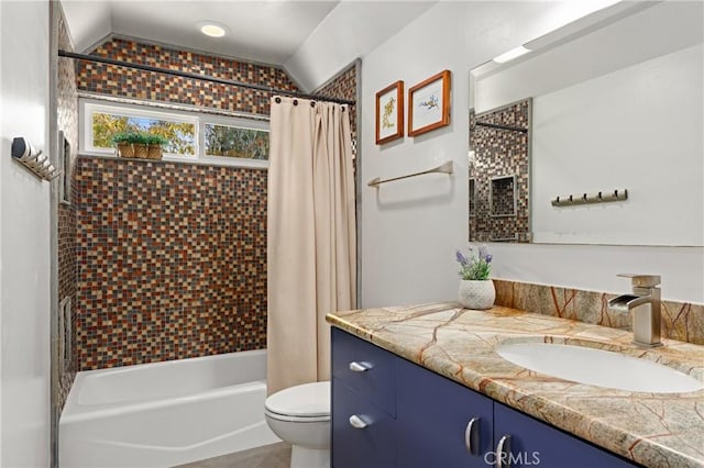 full bath featuring shower / bathtub combination with curtain, vaulted ceiling, vanity, and toilet