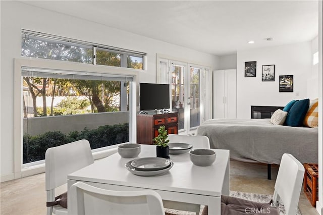 bedroom with french doors, recessed lighting, and access to exterior