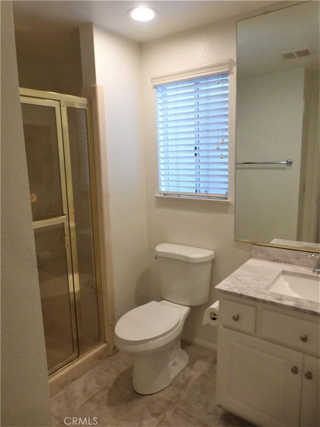 full bath with visible vents, a stall shower, tile patterned flooring, and vanity