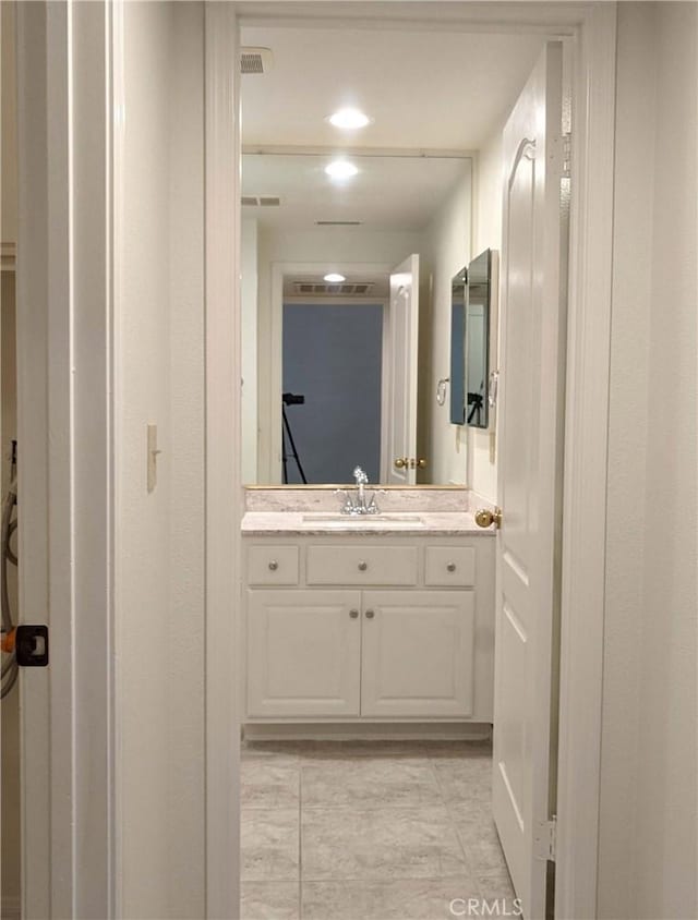 bathroom featuring visible vents and vanity