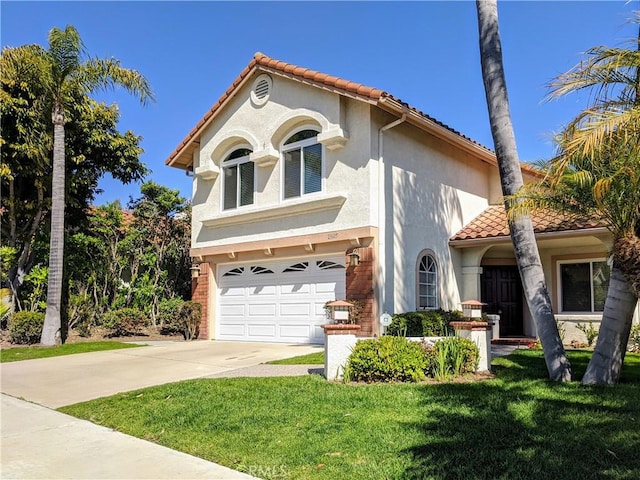 mediterranean / spanish home with a garage, concrete driveway, a tiled roof, stucco siding, and a front yard