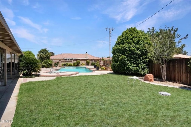 view of yard featuring a fenced in pool, a fenced backyard, and a patio