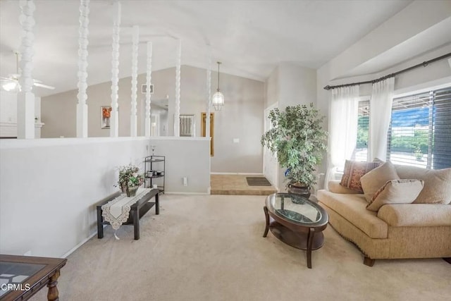 carpeted living area featuring lofted ceiling and ceiling fan