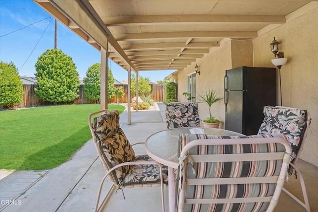 view of patio featuring outdoor dining space and a fenced backyard