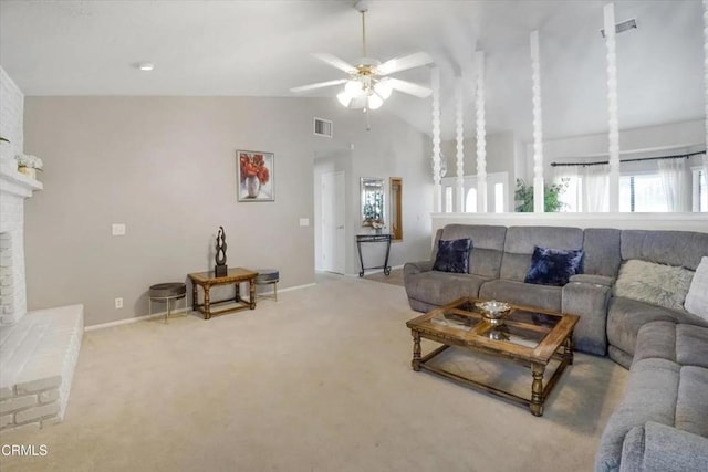 carpeted living room featuring ceiling fan, a fireplace, visible vents, and baseboards