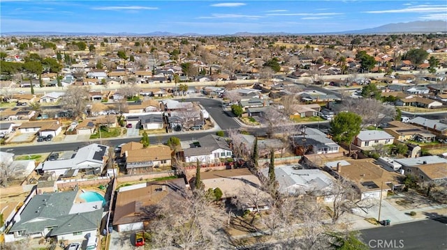 bird's eye view with a residential view and a mountain view