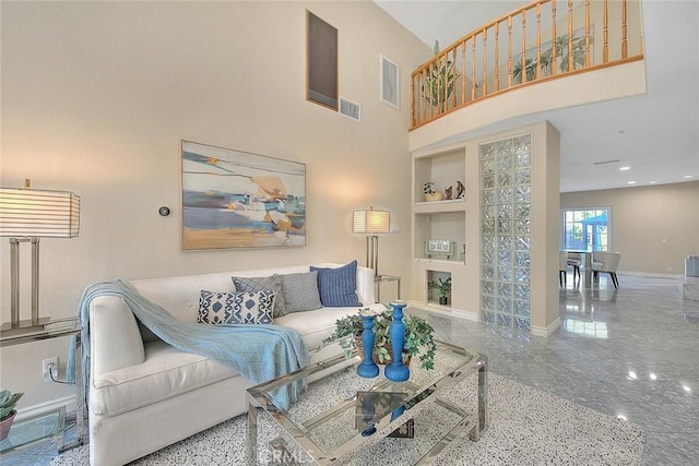 living room featuring recessed lighting, visible vents, built in features, a towering ceiling, and baseboards