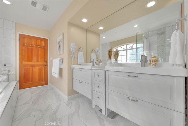 bathroom with marble finish floor, recessed lighting, vanity, tiled shower, and baseboards