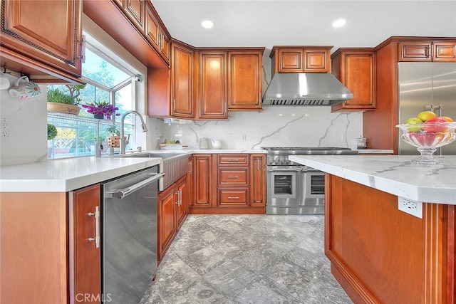 kitchen with under cabinet range hood, high quality appliances, brown cabinets, and backsplash