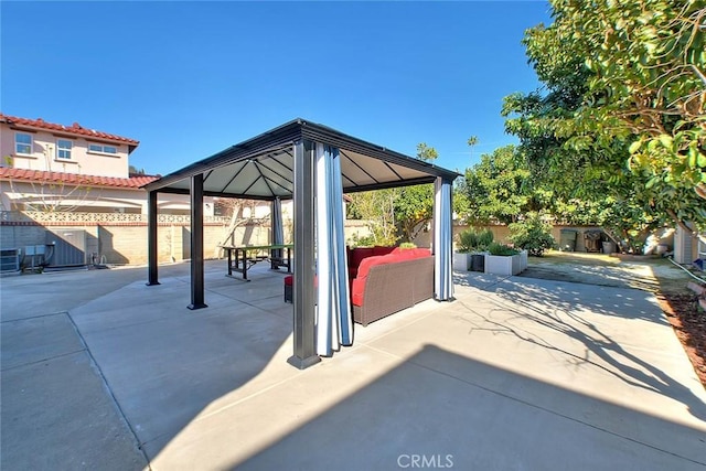 view of patio / terrace featuring fence and a gazebo