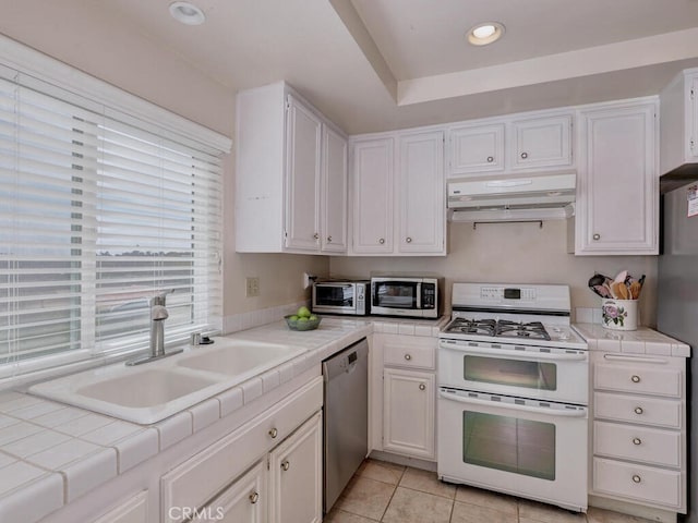 27740 Via Sarasate, Mission Viejo, CA 92692 - kitchen with stainless steel appliances, extractor fan, tile countertops, white cabinets, and recessed lighting
