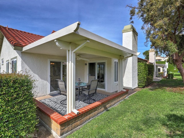 27740 Via Sarasate, Mission Viejo, CA 92692 - back of property with a chimney, a lawn, a patio, and stucco siding