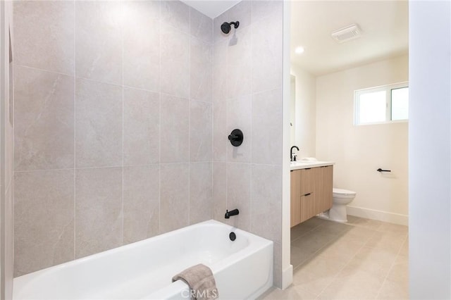 bathroom with bathtub / shower combination, visible vents, toilet, vanity, and baseboards