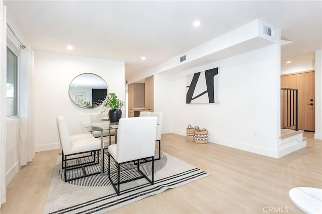 dining area with recessed lighting, baseboards, visible vents, and light wood finished floors