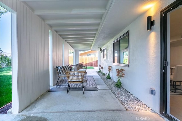 view of patio / terrace featuring fence