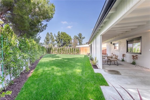 view of yard with a patio area and a fenced backyard