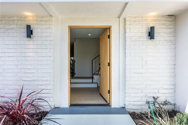 entrance to property with brick siding