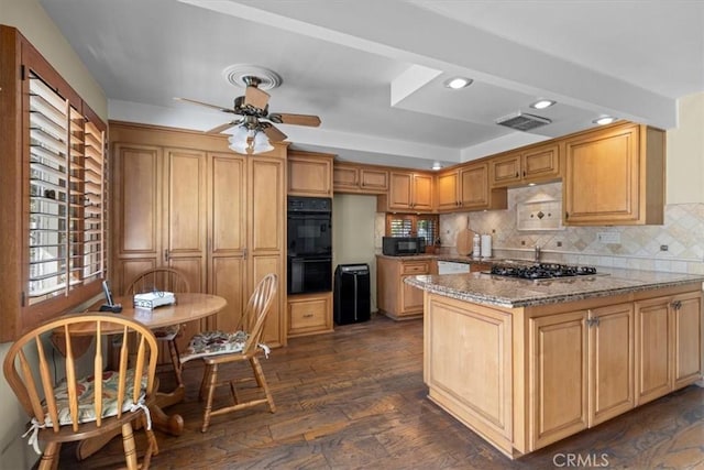 kitchen featuring visible vents, decorative backsplash, light stone countertops, a peninsula, and black appliances