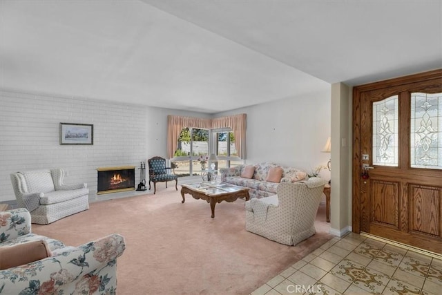 living room with light carpet, a fireplace, and light tile patterned floors