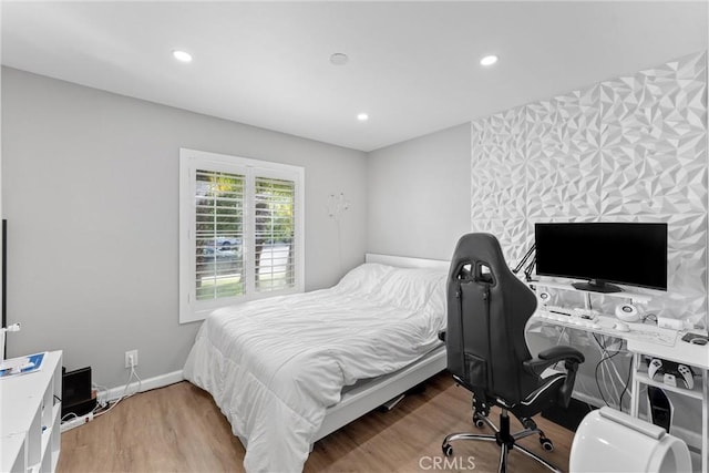 bedroom featuring recessed lighting, baseboards, and wood finished floors