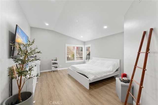 bedroom featuring lofted ceiling, recessed lighting, light wood-type flooring, and baseboards