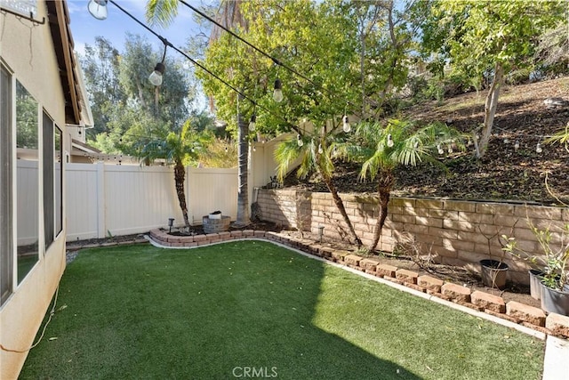 view of yard featuring a fenced backyard