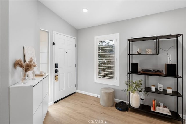 entrance foyer with recessed lighting, baseboards, and light wood-type flooring