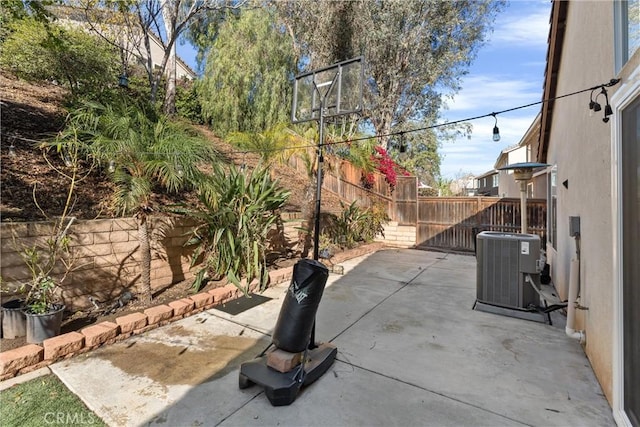 view of patio featuring cooling unit and a fenced backyard