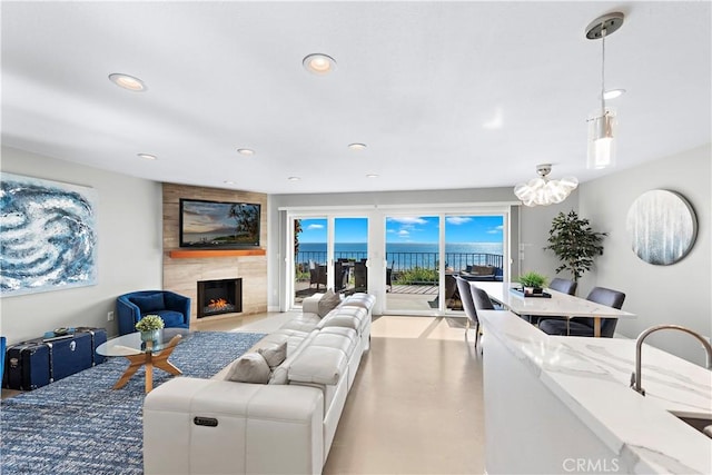 living room featuring a fireplace and recessed lighting