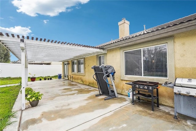 view of patio / terrace featuring fence, grilling area, and a pergola