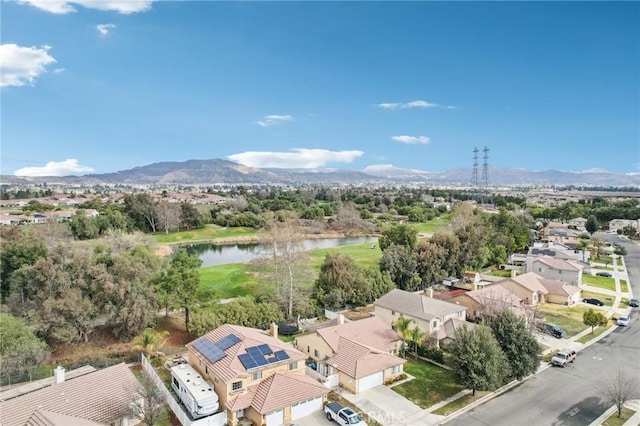 aerial view featuring a water and mountain view