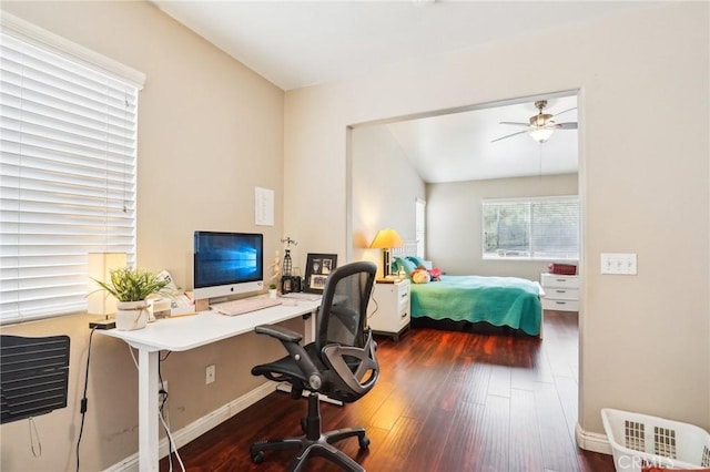 bedroom with wood finished floors and baseboards