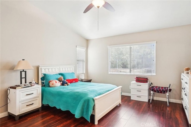 bedroom featuring lofted ceiling, ceiling fan, baseboards, and wood finished floors