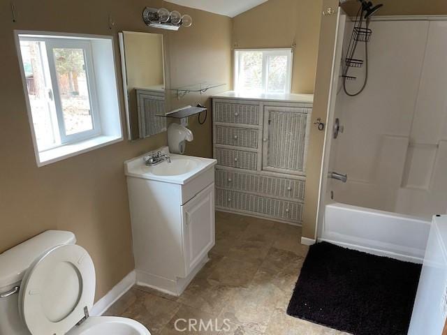 bathroom featuring baseboards, toilet, shower / tub combination, vaulted ceiling, and vanity