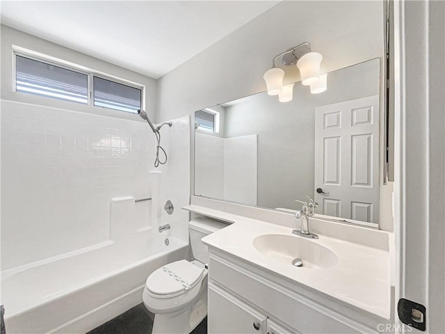 full bath featuring tub / shower combination, vanity, and toilet