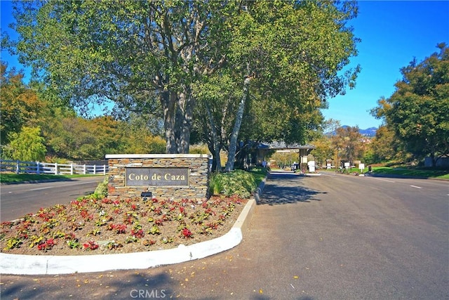 community sign with fence