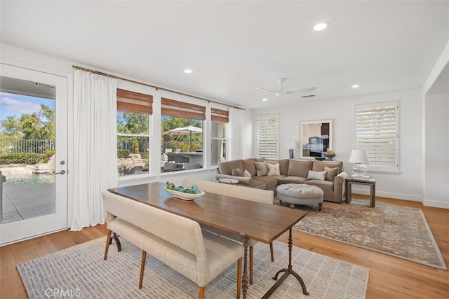 dining space with recessed lighting, a ceiling fan, and wood finished floors