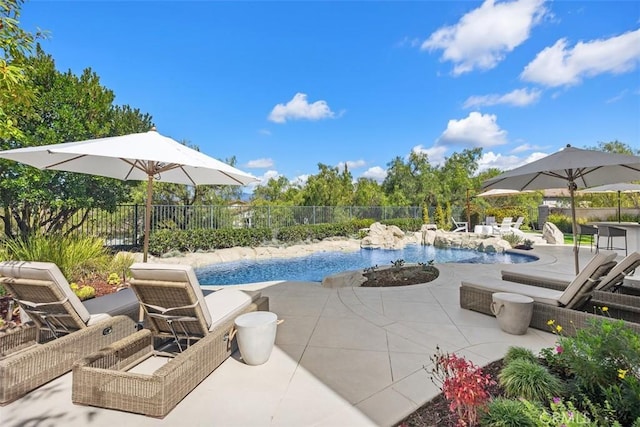 view of pool with a fenced in pool, a patio, and fence