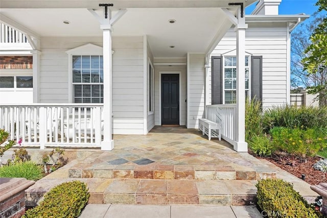 doorway to property featuring a porch