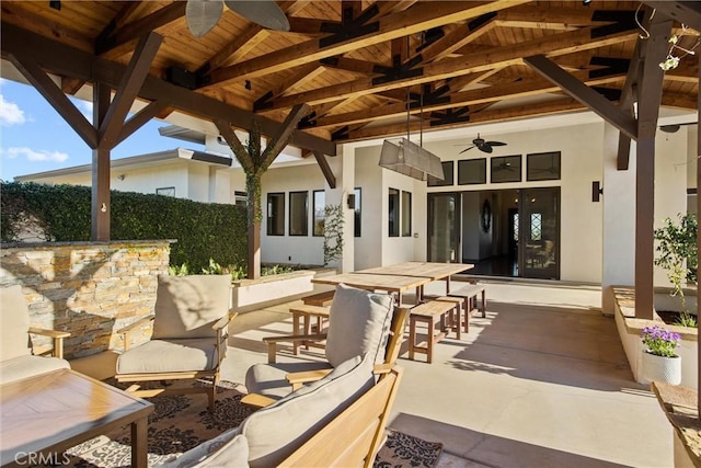 view of patio / terrace with outdoor dining space, outdoor dry bar, and a gazebo