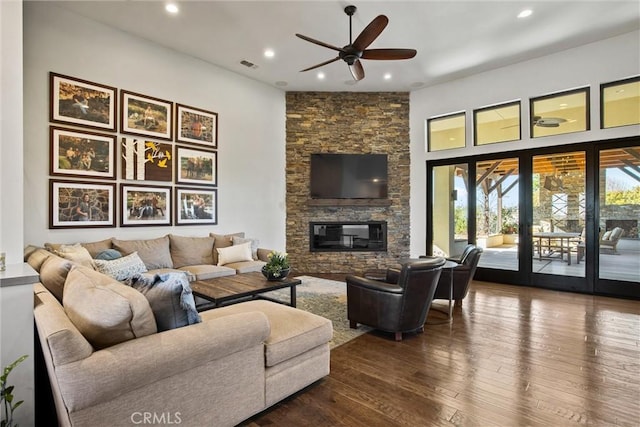 living area featuring dark wood finished floors, a fireplace, recessed lighting, visible vents, and ceiling fan