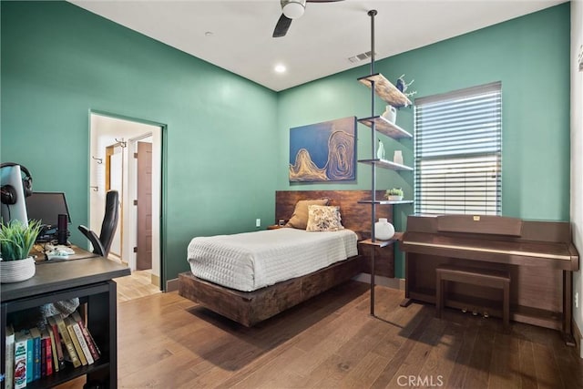 bedroom with visible vents, wood finished floors, and recessed lighting