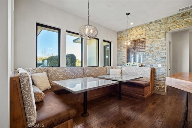 sitting room featuring visible vents and dark wood finished floors