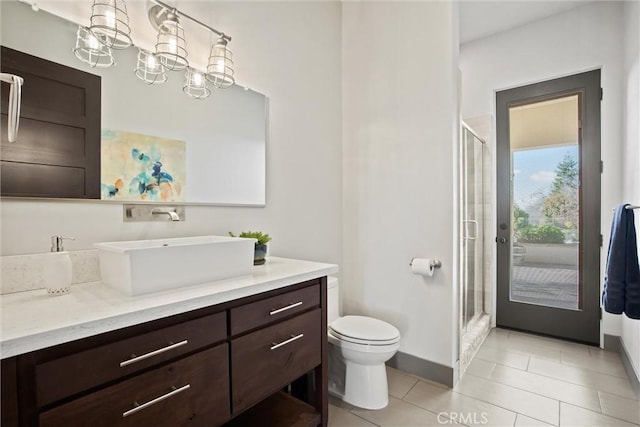 full bathroom featuring tile patterned floors, a shower stall, toilet, and vanity