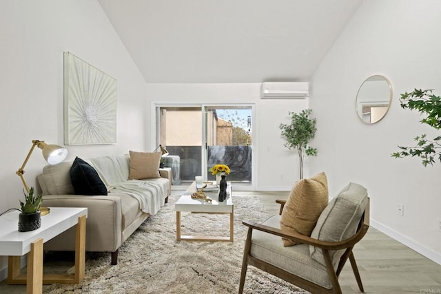 living room featuring lofted ceiling, wood finished floors, baseboards, and a wall mounted AC