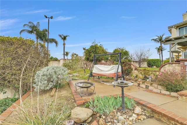 6153 Peridot Ave, Alta Loma, CA 91701 - fenced backyard with a patio and an outdoor fire pit
