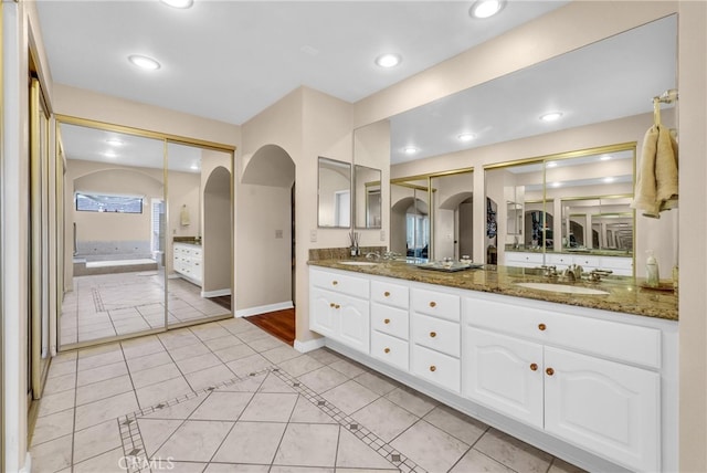 6153 Peridot Ave, Alta Loma, CA 91701 - bathroom with tile patterned flooring, double vanity, recessed lighting, and baseboards