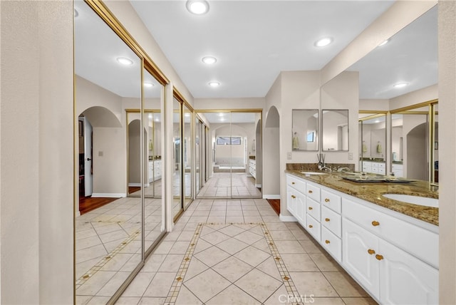 6153 Peridot Ave, Alta Loma, CA 91701 - full bath with baseboards, tile patterned floors, double vanity, recessed lighting, and inlaid floor details