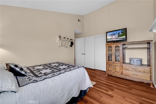 6153 Peridot Ave, Alta Loma, CA 91701 - bedroom featuring wood finished floors, a closet, and a high ceiling