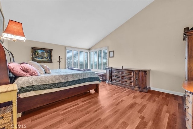 6153 Peridot Ave, Alta Loma, CA 91701 - bedroom featuring wood finished floors, baseboards, and high vaulted ceiling